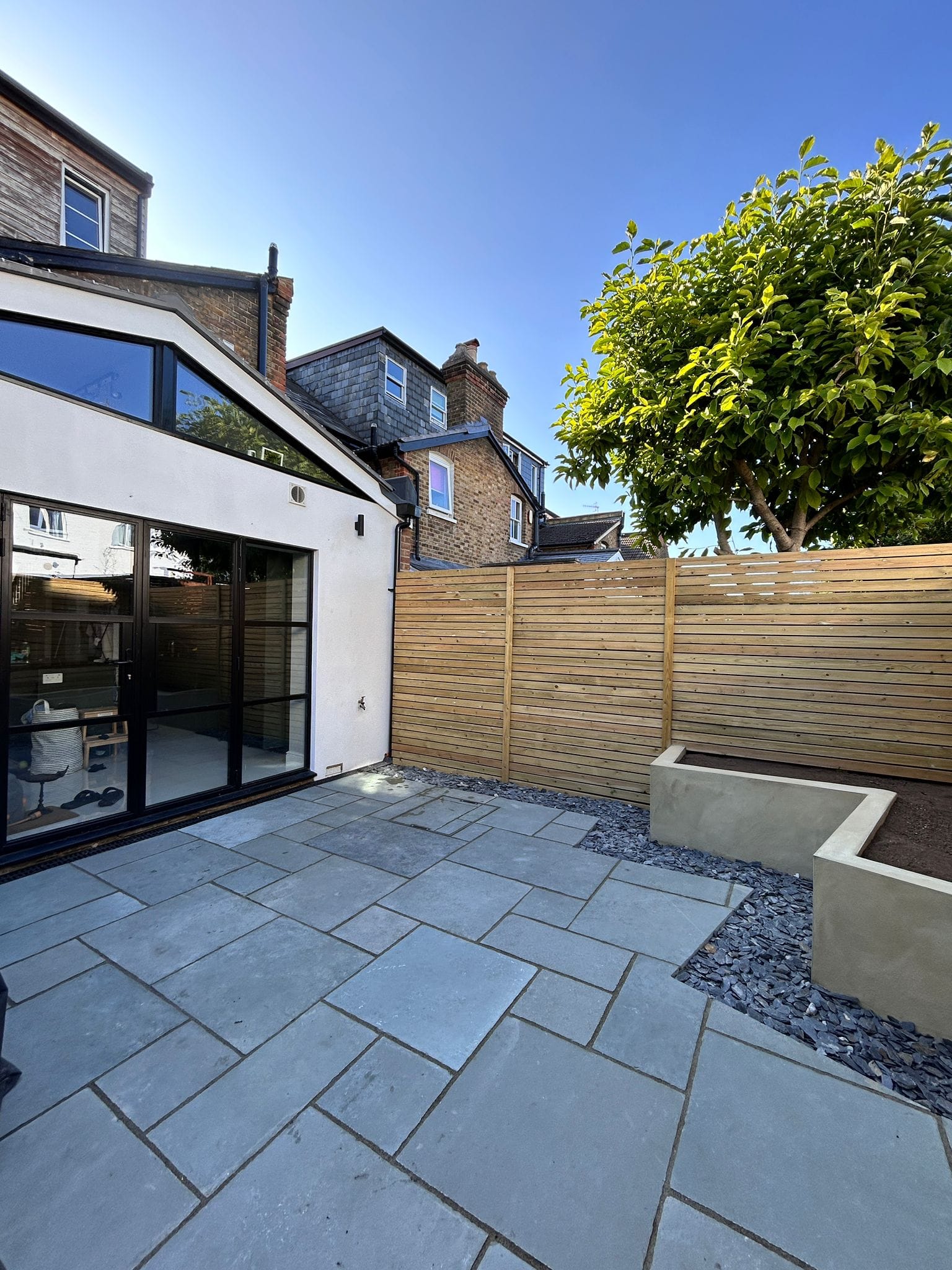 Contemporary Fencing and rendered planter