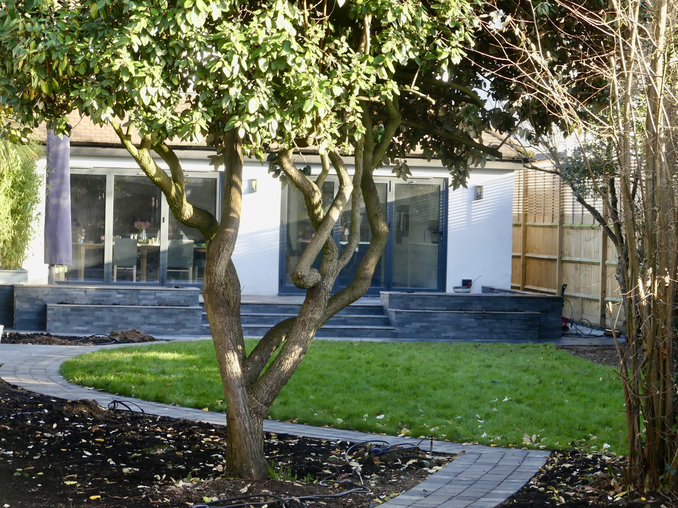 Porcelain and Sandstone Paving complimented with Slate Cladding