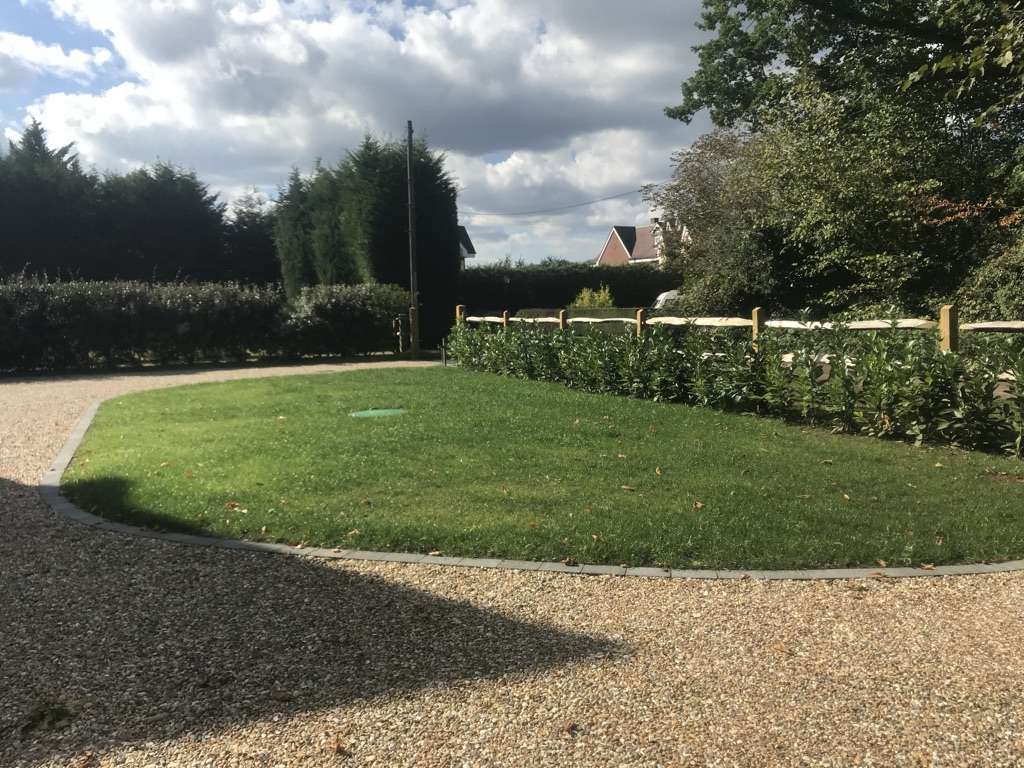 A new “in, out” drive finished with turfing and fencing